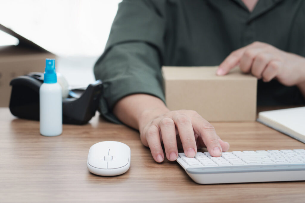 Hands using a keyboard and mouse