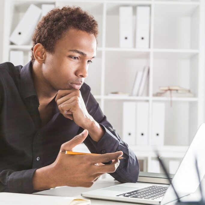 A man studying on his laptop